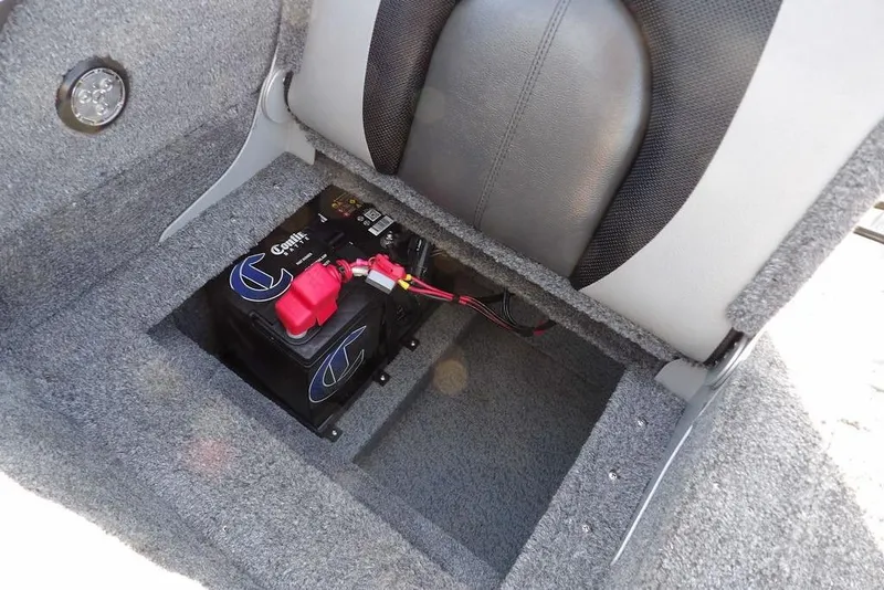 Slide: The Image of 2025 Lund 1875 Crossover XS boat battery compartment with secure installation. - 10