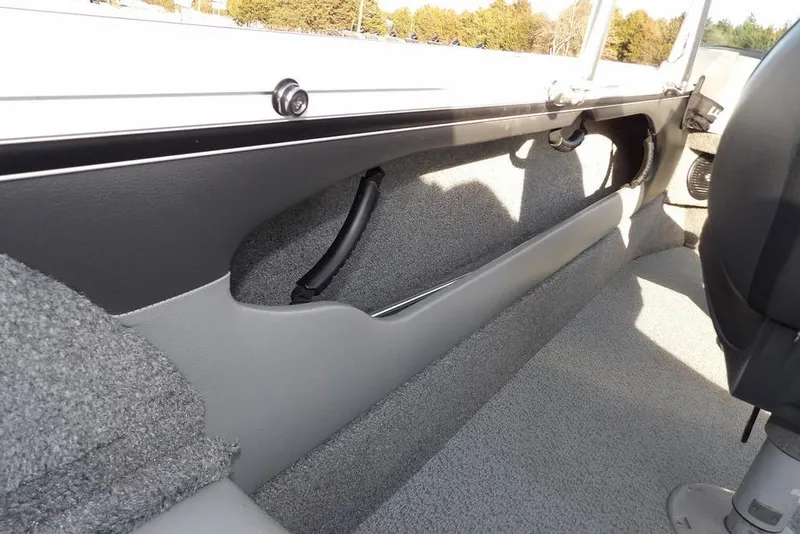 Slide: The Image of Interior view of 2025 Lund 1875 Crossover XS boat, showcasing seating and storage. - 13