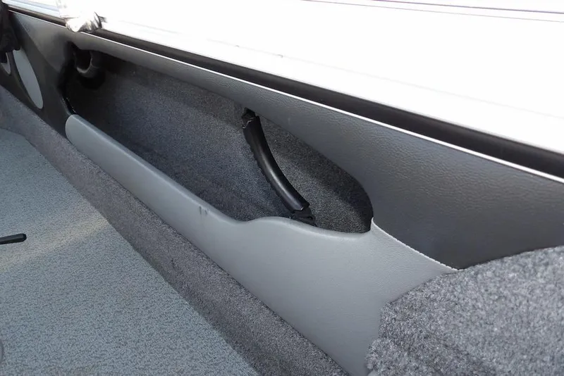 Slide: The Image of Interior view of 2025 Lund 1875 Crossover XS boat, featuring storage compartment. - 15
