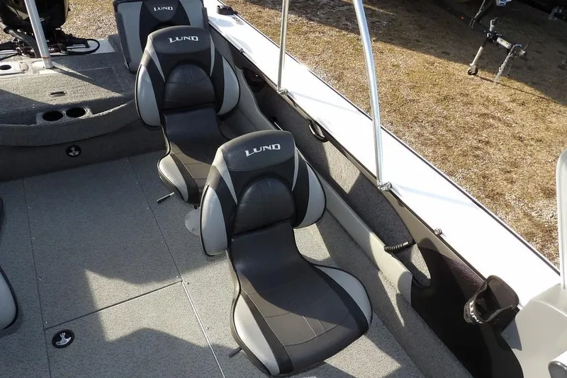 Slide: The Image of 2025 Lund 1875 Crossover XS boat interior with comfortable seating and modern design. - 16