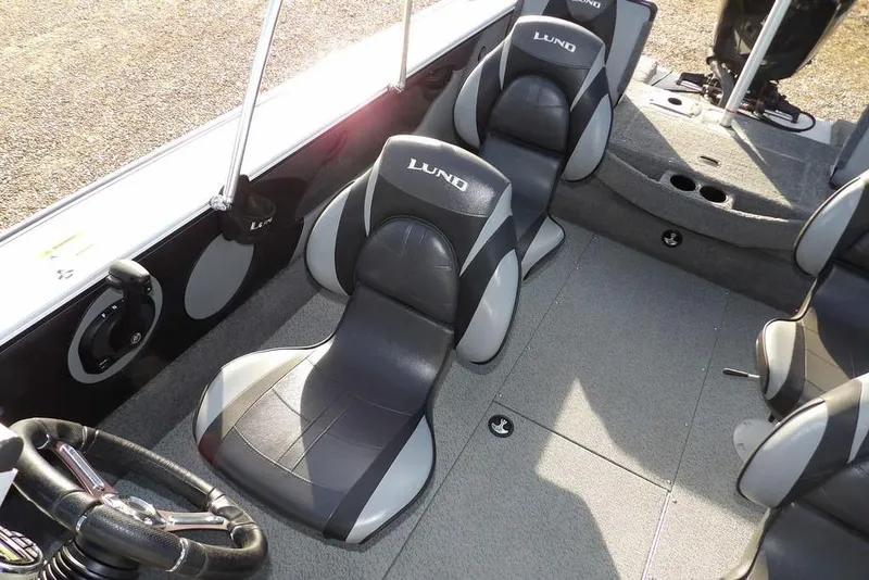 Slide: The Image of 2025 Lund 1875 Crossover XS boat interior with sleek seating and modern design. - 20