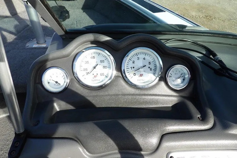 Slide: The Image of Dashboard of 2025 Lund 1875 Crossover XS boat with speedometer and fuel gauges. - 24