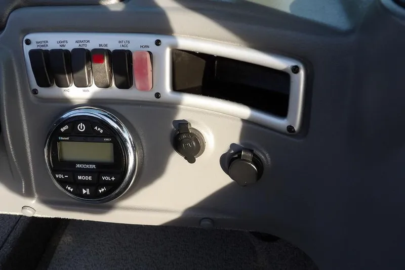 Slide: The Image of Control panel of 2025 Lund 1875 Crossover XS boat with switches and audio system. - 27