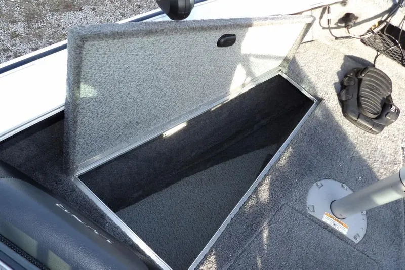 Slide: The Image of Open storage compartment in 2025 Lund 1875 Crossover XS boat interior. - 29