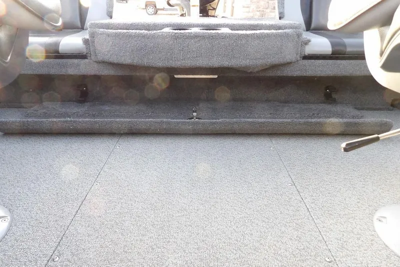 Slide: The Image of 2025 Lund 1875 Crossover XS interior with carpeted flooring and seating area. - 37