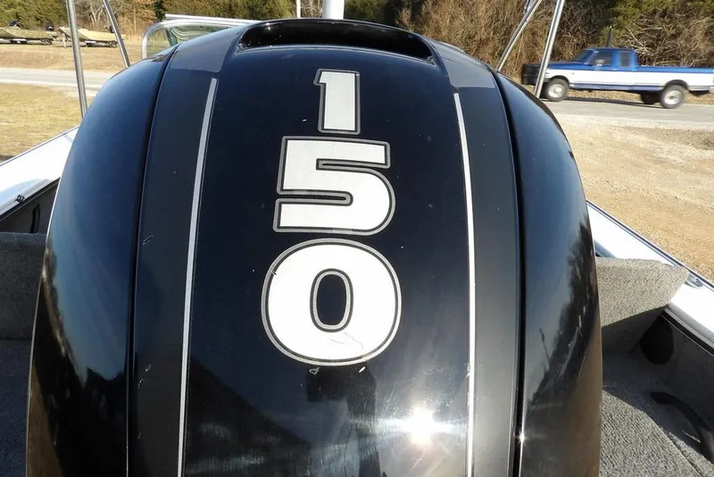 Slide: The Image of Outboard motor with "150" on a 2025 Lund 1875 Crossover XS boat. - 42