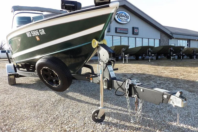 Slide: The Image of 2025 Lund 1875 Crossover XS boat on trailer at White's Marine Center. - 44