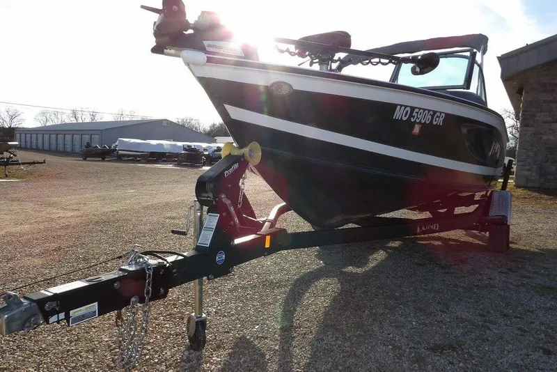 Slide: The Image of 2025 Lund 1875 Crossover XS boat on trailer in outdoor setting. - 46