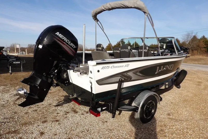 Slide: The Image of 2025 Lund 1875 Crossover XS boat with Mercury engine on trailer. - 8