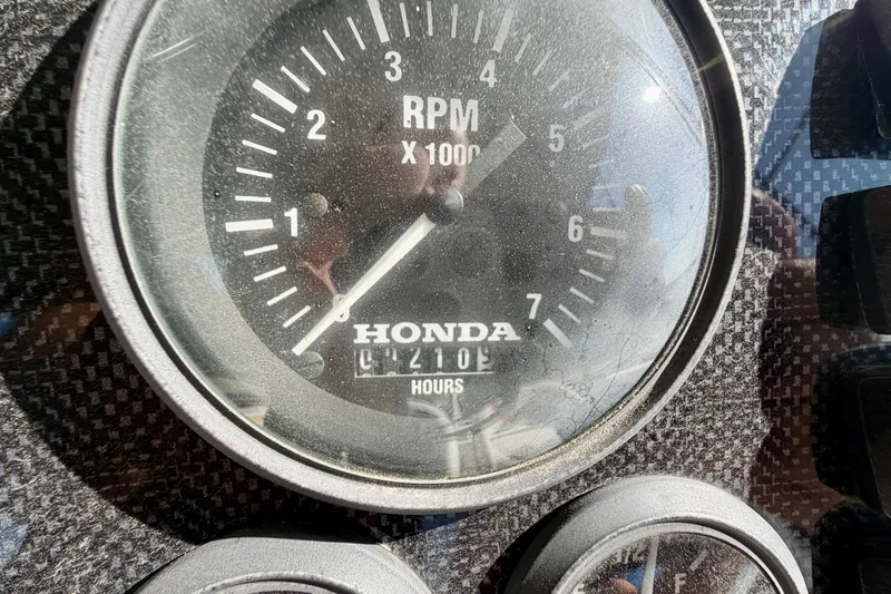 Slide: The Image of Close-up of a Honda RPM gauge on a 2004 PlayCraft 22 Bay Charger boat. - 12