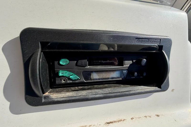 Slide: The Image of 2004 PlayCraft 22 Bay Charger boat stereo system, featuring Aquatronics controls. - 13