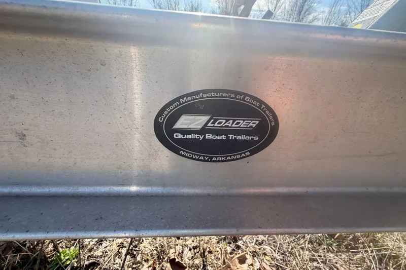 Slide: The Image of Sticker on EZ Loader boat trailer, Midway, Arkansas, for 2004 PlayCraft 22 Bay Charger. - 28