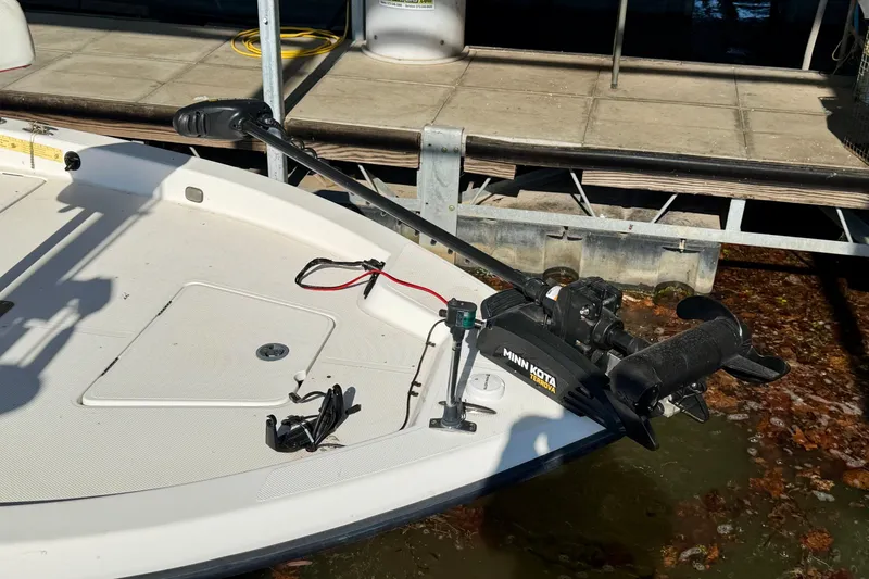 Slide: The Image of 2004 PlayCraft 22 Bay Charger boat with Minn Kota trolling motor at dock. - 4