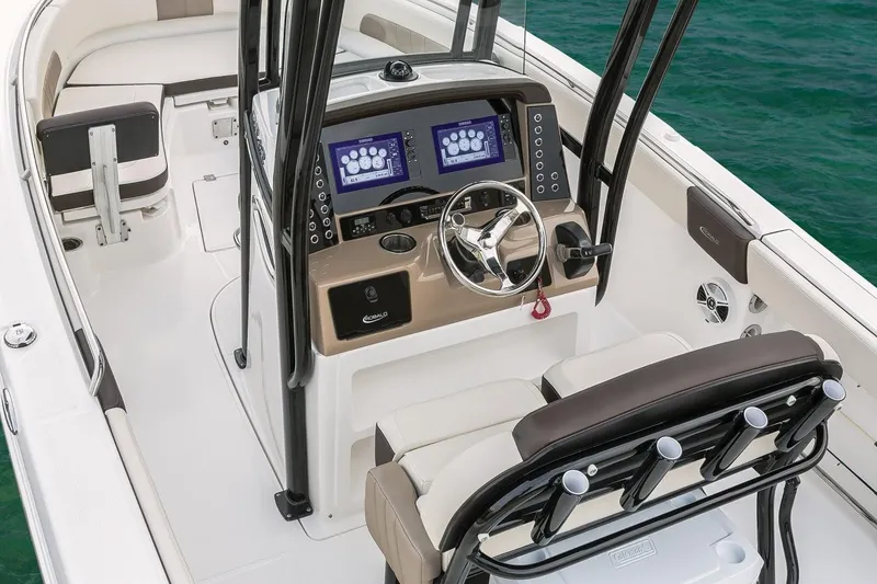 Slide: The Image of Manufacturer Provided Image: 2019 Robalo R242 Explorer boat cockpit with dual screens and steering wheel. - 5