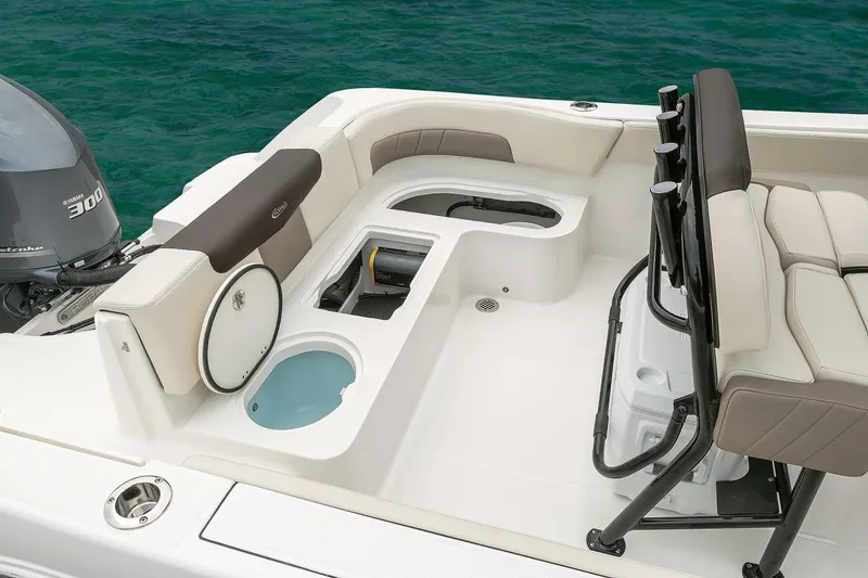 Slide: The Image of Manufacturer Provided Image: 2019 Robalo R242 Explorer boat interior with seating and storage compartments. - 8