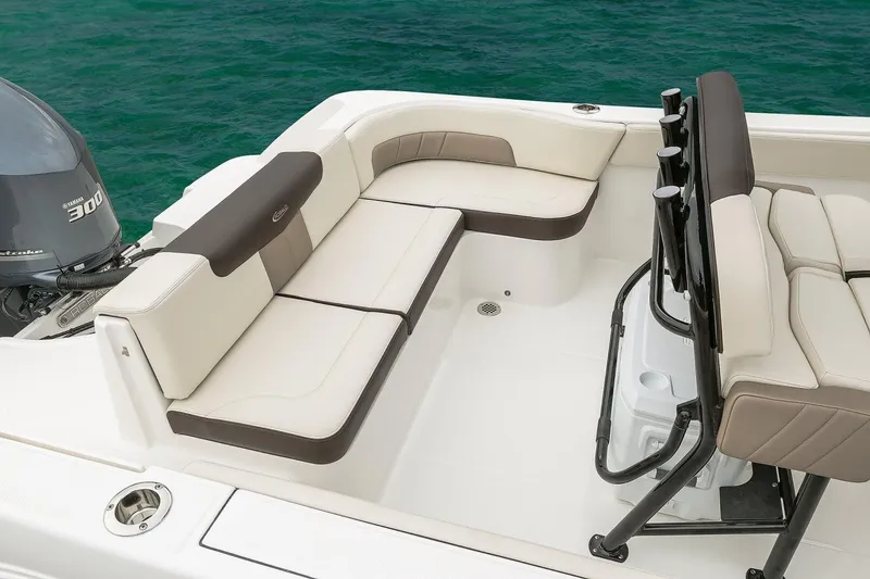 Slide: The Image of Manufacturer Provided Image: 2019 Robalo R242 Explorer boat interior with cushioned seating. - 9