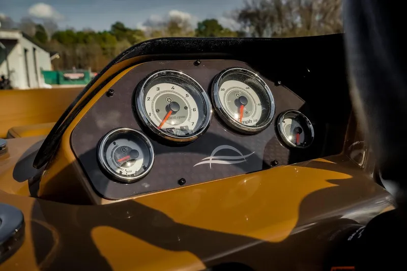 Slide: The Image of Dashboard of 2025 SunCatcher Fusion 324RC boat with gauges and controls. - 14