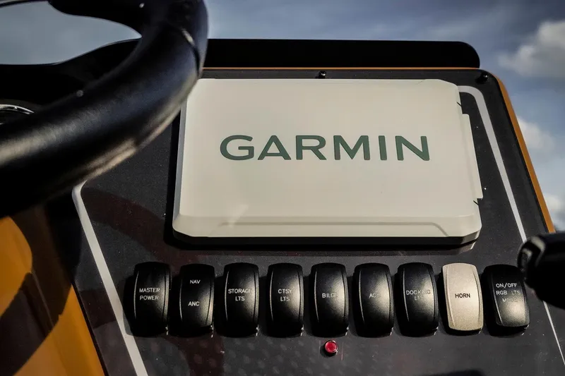 Slide: The Image of Control panel of 2025 SunCatcher Fusion 324RC with Garmin navigation system. - 16