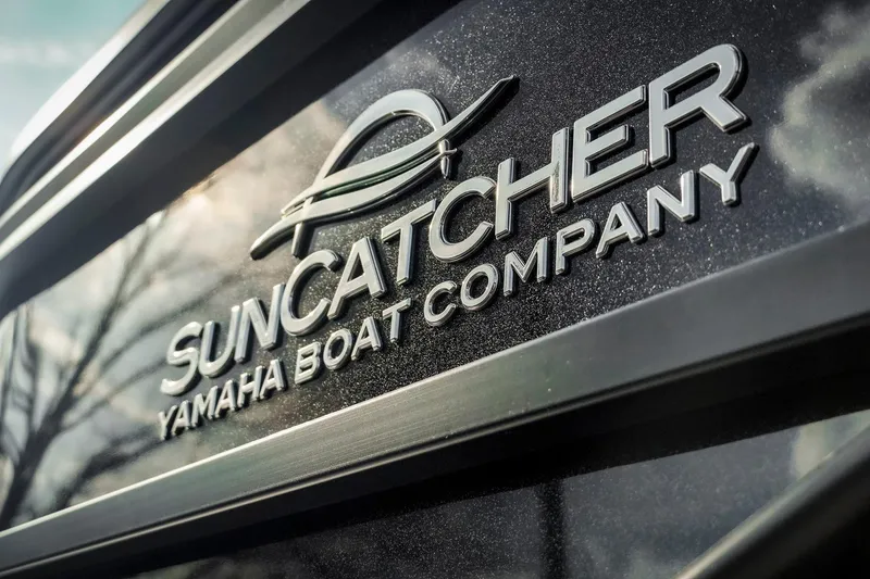 Slide: The Image of SunCatcher Fusion 324RC 2025 logo on Yamaha Boat Company exterior. - 19