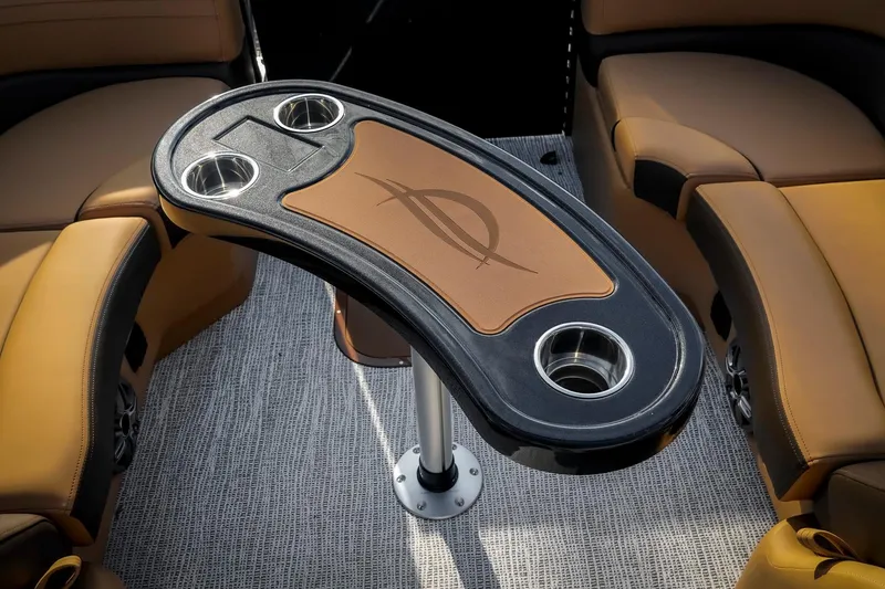 Slide: The Image of 2025 SunCatcher Fusion 324RC boat interior with stylish table and cup holders. - 26