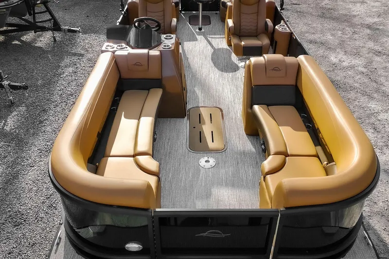 Slide: The Image of 2025 SunCatcher Fusion 324RC pontoon boat with luxurious tan seating and modern design. - 5