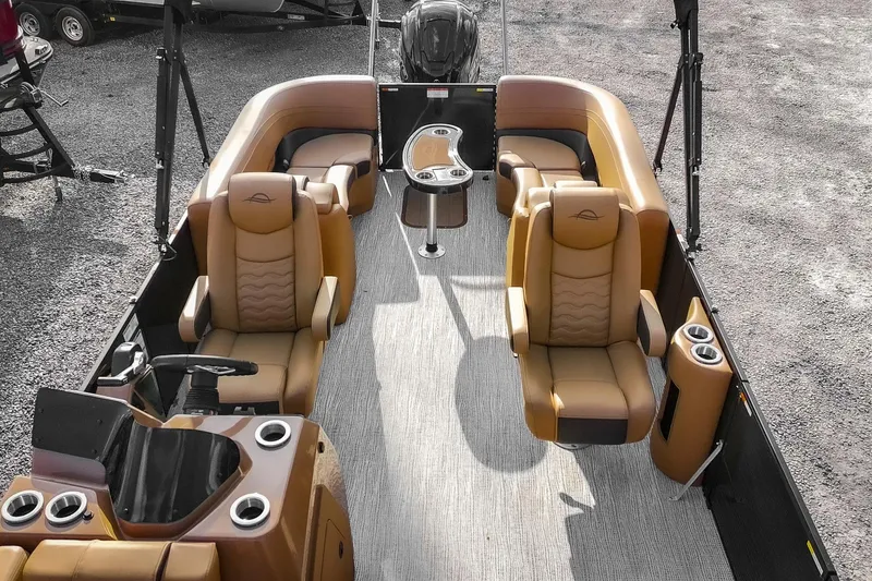 Slide: The Image of 2025 SunCatcher Fusion 324RC pontoon boat interior with luxurious seating and modern design. - 6