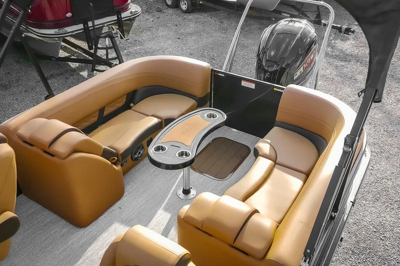 Slide: The Image of Luxurious 2025 SunCatcher Fusion 324RC pontoon boat with plush seating and modern design. - 7