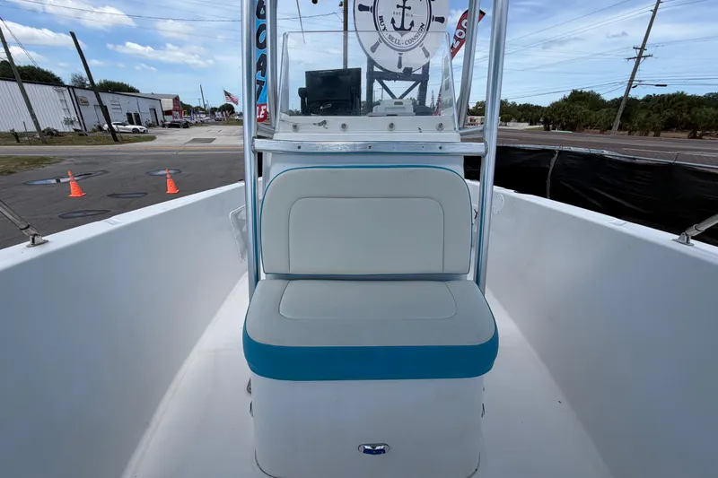 Slide: The Image of 2005 Angler 204CC boat interior with cushioned seating and control panel. - 40
