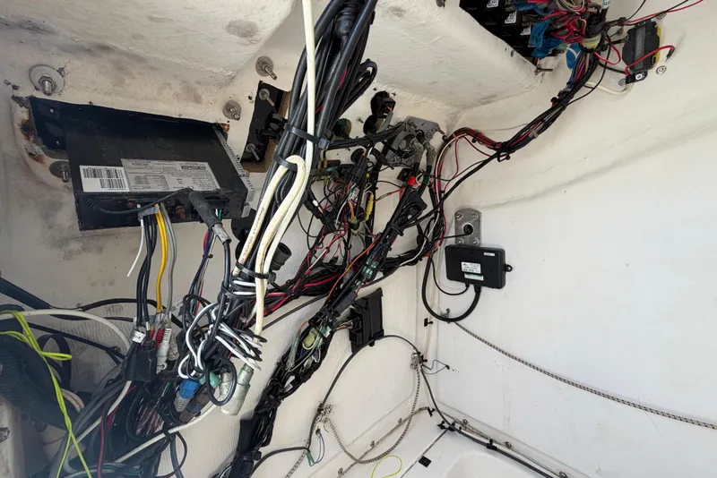 Slide: The Image of Electrical wiring inside a 2005 Angler 204CC boat, showcasing complex cable arrangement. - 47