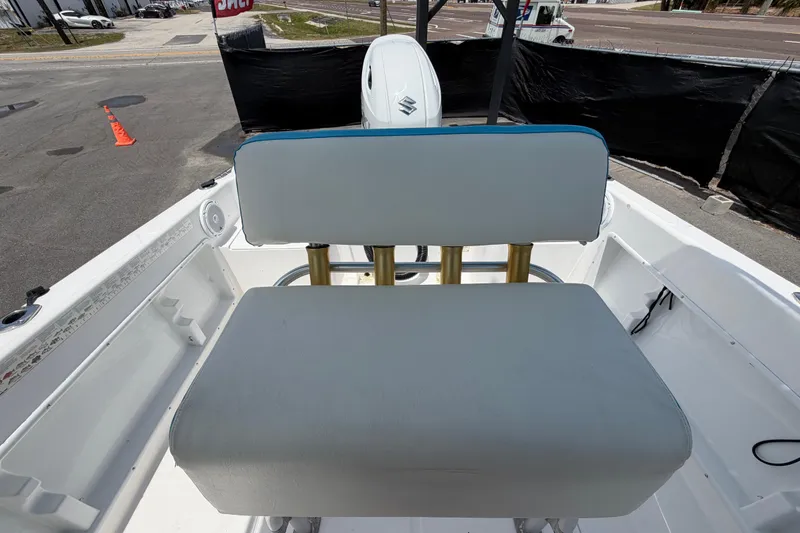 Slide: The Image of 2005 Angler 204CC boat interior with seating and Suzuki outboard motor. - 48