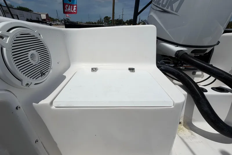 Slide: The Image of 2005 Angler 204CC boat interior with speaker and Suzuki engine. - 50