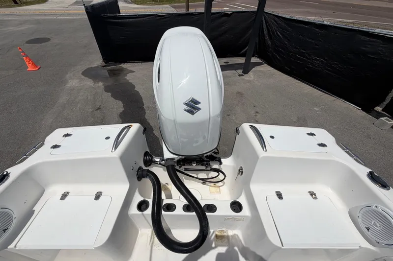 Slide: The Image of 2005 Angler 204CC boat with Suzuki outboard motor, viewed from the rear deck. - 58