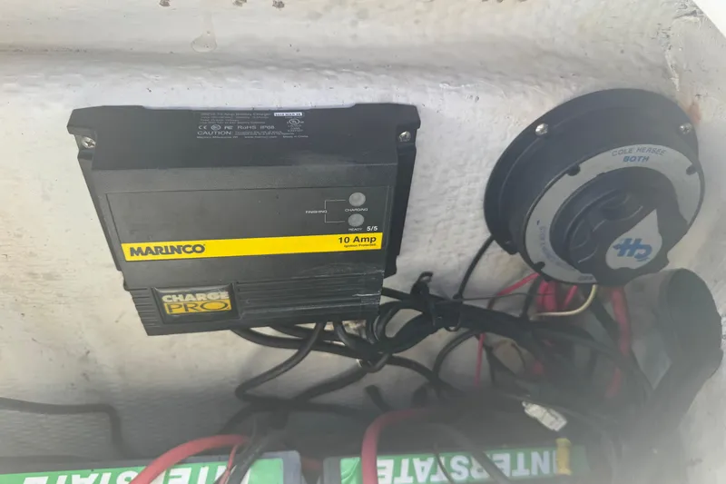 Slide: The Image of 2005 Angler 204 Center Console boat lifted outside a warehouse. - 11