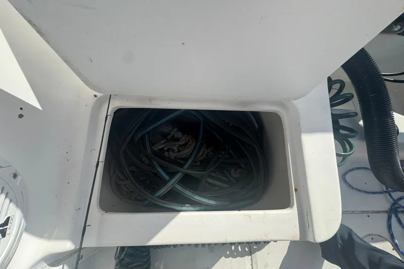 Slide: The Image of 2005 Angler 204 Center Console boat with Suzuki outboard motor at dock. - 12