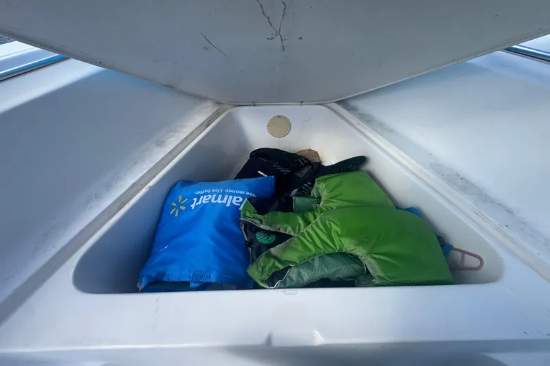 Slide: The Image of Electrical setup in a 2005 Angler 204 Center Console boat with batteries and charger. - 15