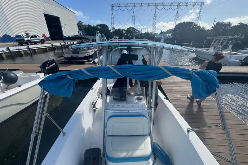 Slide: The Image of Storage compartment on a 2005 Angler 204 Center Console boat with coiled ropes. - 17
