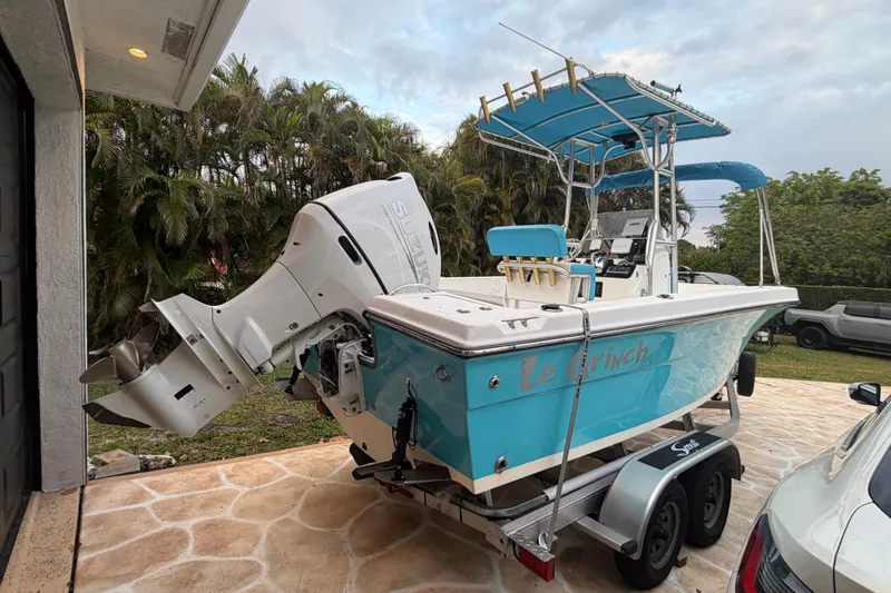 Slide: The Image of 2005 Angler 204 Center Console boat with Suzuki outboard motor on trailer. - 5