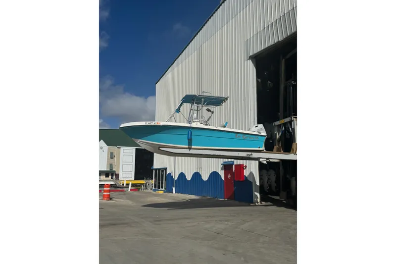 Slide: The Image of 2005 Angler 204 Center Console boat with Suzuki outboard motor on trailer. - 6