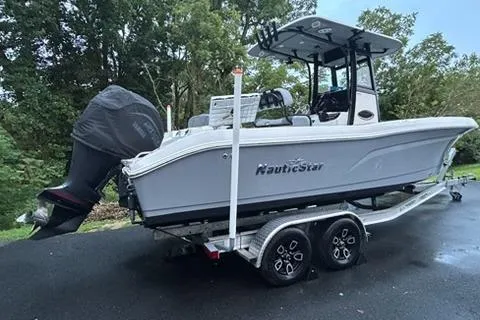 The Image of 2023 NauticStar 24 Legacy boat on trailer, parked outdoors. - 0