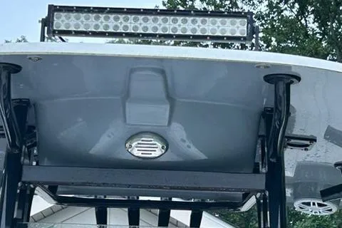 Slide: The Image of 2023 NauticStar 24 Legacy boat with LED light bar and sleek design. - 7