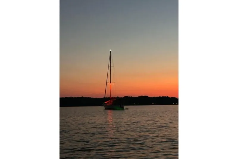 The Image of Sailboat Catalina 42, 1998 model, at sunset on calm waters. - 0