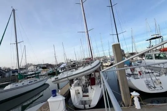 Slide: The Image of Marina with 1998 Catalina 42 sailboats docked under a clear blue sky. - 19