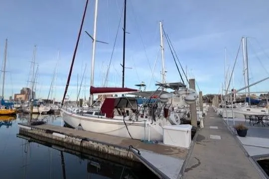 Slide: The Image of Sailboat docked at marina, Catalina 42 model, 1998, with clear blue sky. - 20