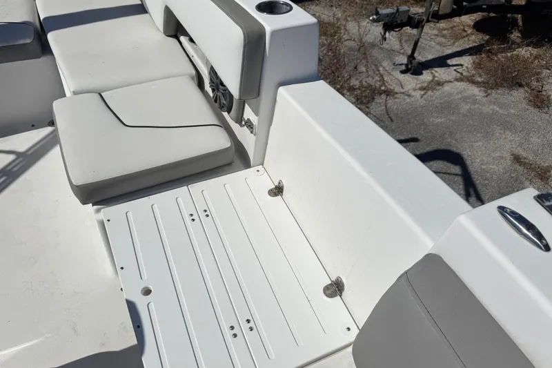 Slide: The Image of 2020 Glastron GTD 240 boat interior with white seating and deck details. - 14