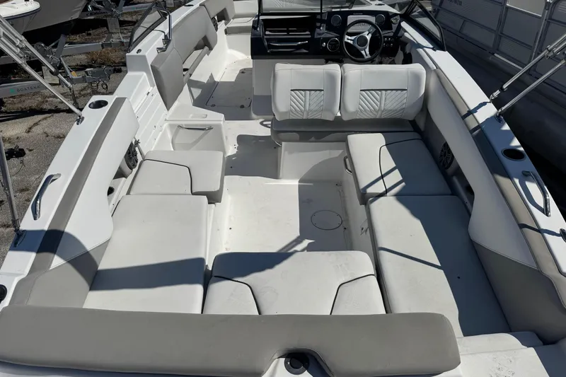 Slide: The Image of 2020 Glastron GTD 240 boat interior with spacious seating and modern dashboard. - 8