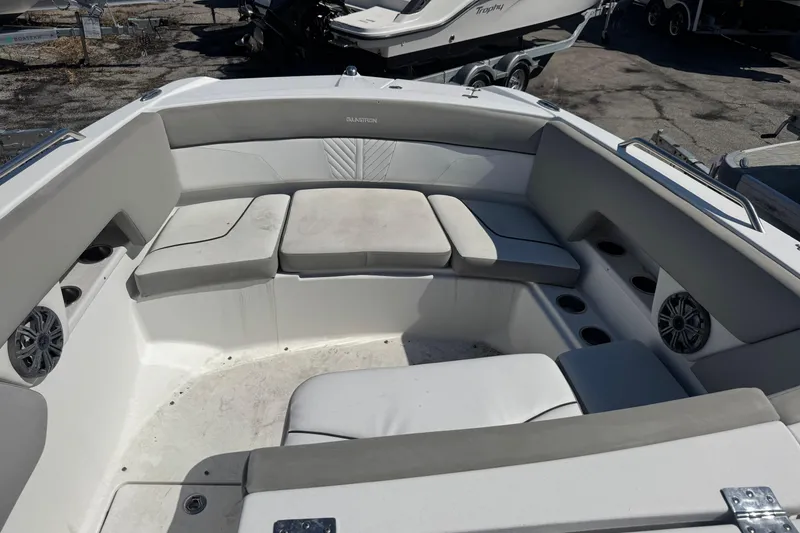 Slide: The Image of 2020 Glastron GTD 240 boat interior with cushioned seating and cup holders. - 9