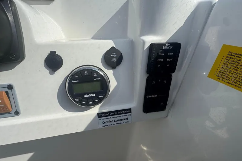 Slide: The Image of Control panel of 2021 Key West 203 DFS boat with Clarion audio system and Lenco controls. - 14
