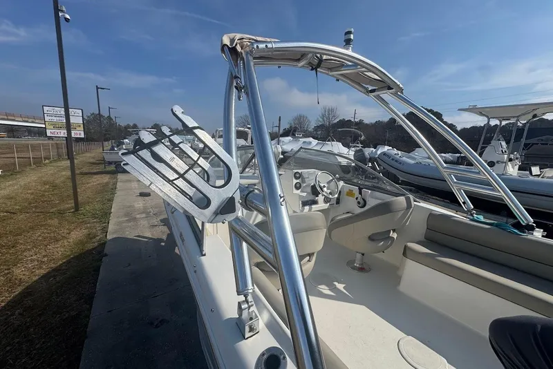 Slide: The Image of 2021 Key West 203 DFS boat with sleek design and modern features, docked outdoors. - 8