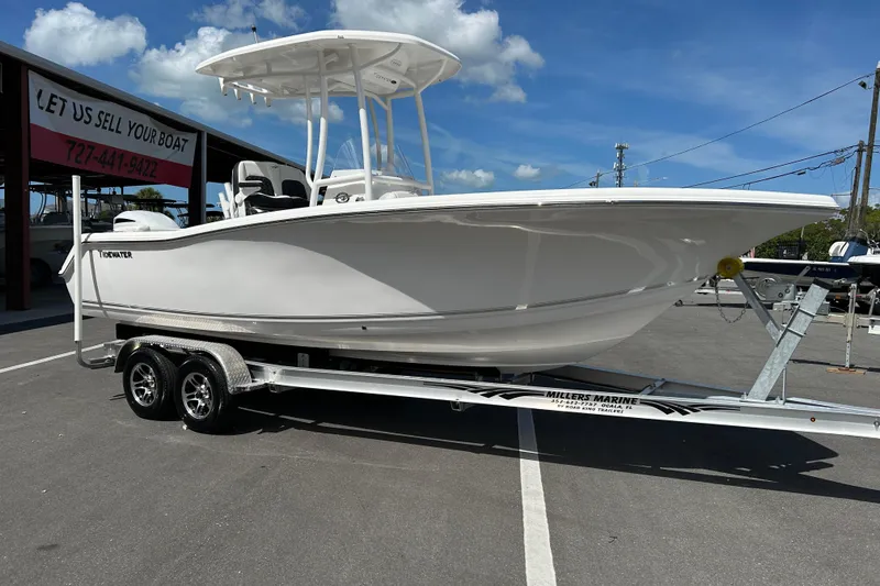 The Image of 2024 Tidewater 220 LXF boat on trailer under clear blue sky. - 1