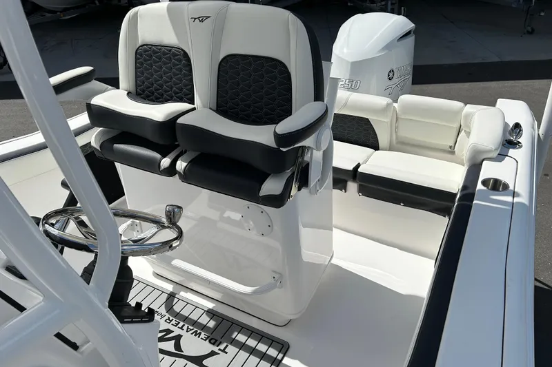 Slide: The Image of 2024 Tidewater 220 LXF boat interior with dual seats and Yamaha engine. - 11